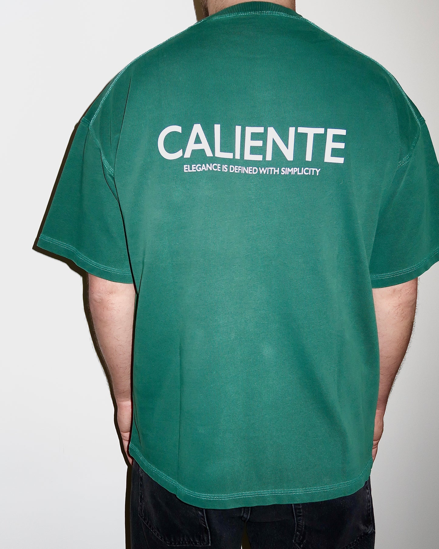 Green oversized boxy fit t-shirt for men and women, stylish and comfortable casual wear, perfect for a relaxed, laid-back look. Soft cotton fabric, available in various sizes, ideal for layering or wearing alone. Trendy streetwear style with a loose, modern fit. Luxury Garment.

300GSM, Made in Portugal.

Similar to Represent, Cole Buxton.